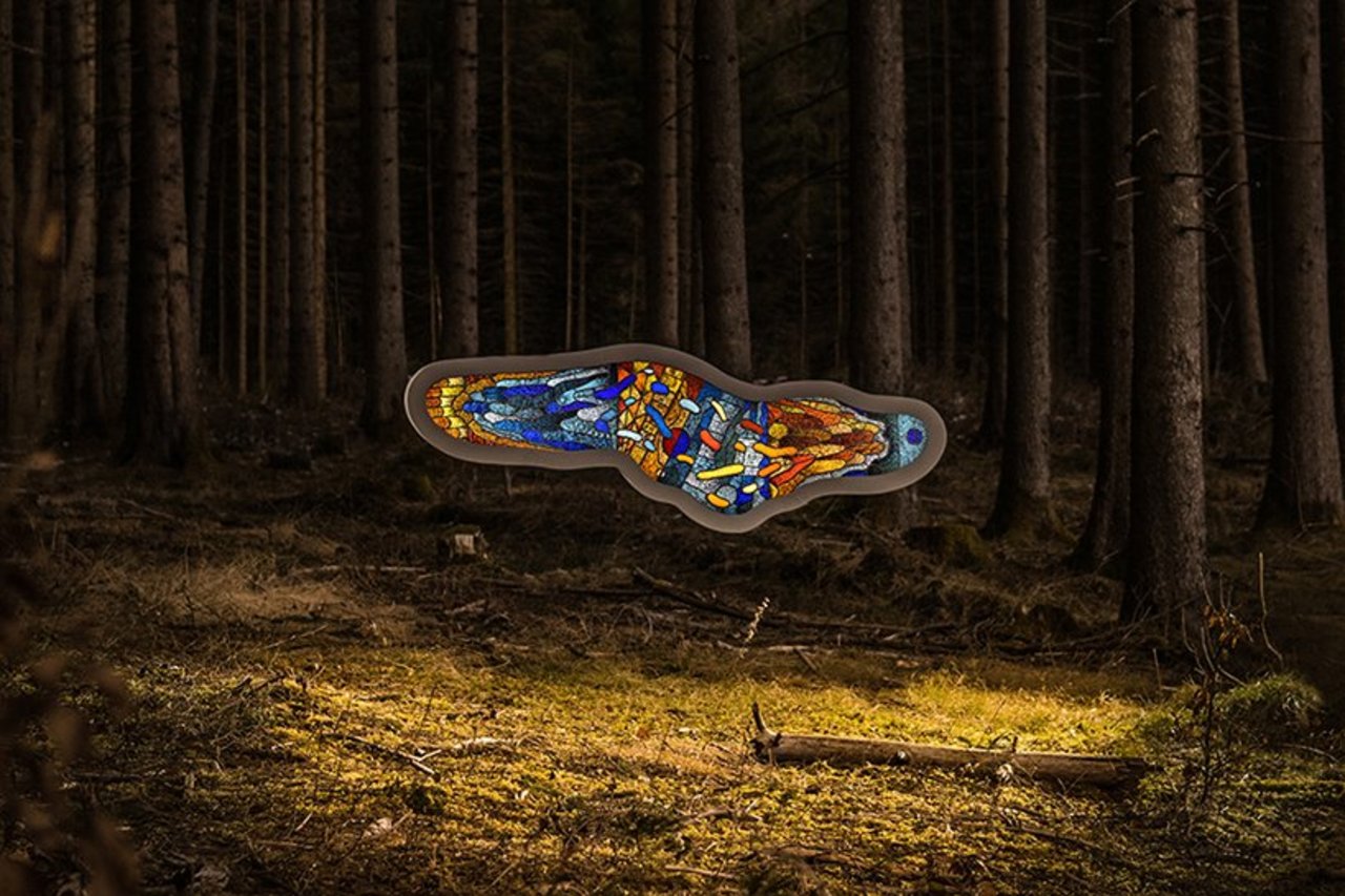 Thomas Medicus sets surreal stained glass amoeba sculpture in the woods https://t.co/YRnQB8sata